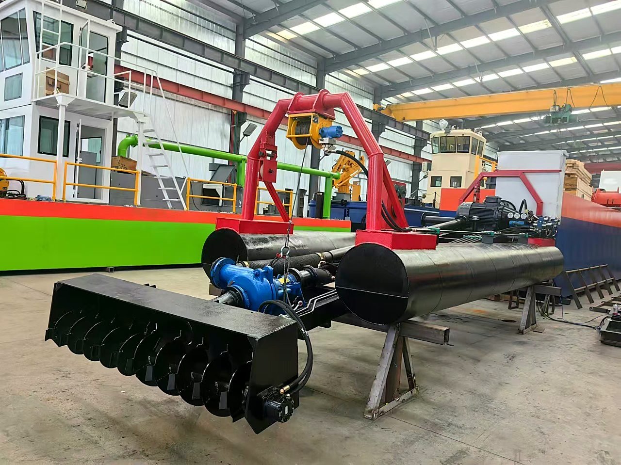 GPS dredging unit working a channel with bottom membrane